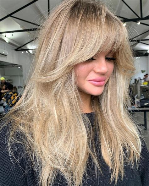 blonde hair with bangs and layers